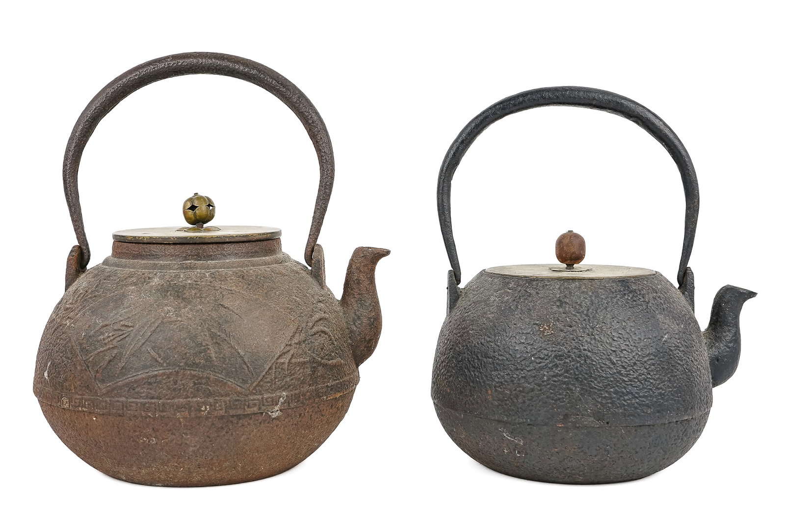 19th c Japanese Tetsubin Cast Iron Tea Pots: 19th c Japanese Tetsubin Cast Iron Tea Pots, one with raised design and signed bronze lid, diameter 7", ht with handle 9", the other also with bronze lid, dia 6", ht with handle 8 1/2"