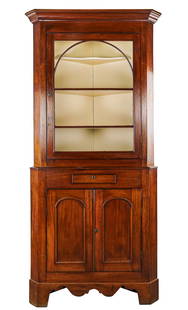 Ca. 1840 American 36" Wide Walnut 2 Part Corner Cupboard: Ca. 1840 walnut 2 part corner cupboard. Upper section with single glazed door having 3 glass panels matching shelf height. Lower section with single drawer over two tombstone panel doors on a bracket