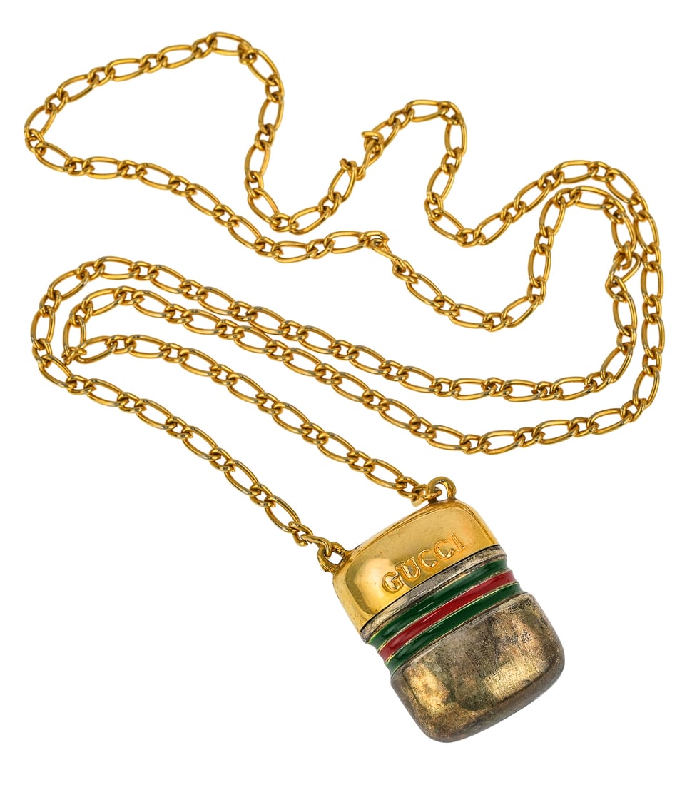 Gucci Pill Box Chain Necklace: Gold tone 28" long Gucci necklace with Pill Box Pendant, enameled green and red and signed GUCCI ITALY. Pendant is a pill box, firm closure, measures 1.25 x 1 in.