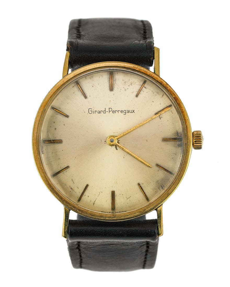 Vintage Men's Girard-Perregaux Wrist Watch: Vintage men's Girard-Perregaux wrist watch. Yellow gold, stainless steel back, 33 mm round case, silvered face with gold hands and hour marks. Wind movement currently running. Older leather strap. Has