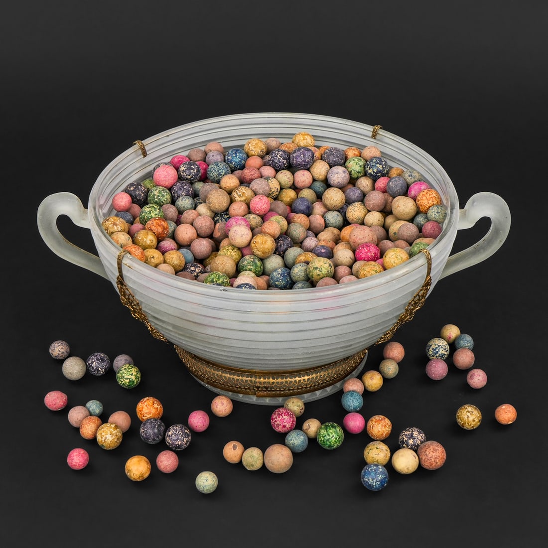 19th c Clay marbles: Bowl of 19th c Clay marbles in a variety of colors, sold in frosted glass bowl 4.5" high 9" diameter (not counting handles)
