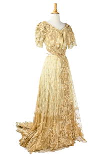 Victorian Lace Outfit: A Victorian outfit made up of a lace covered bodice and skirt. Bodice is ecru silk with antique lace overlay. Additional lace applique on shoulders. Hook and eye closures at back. Measures 16" across