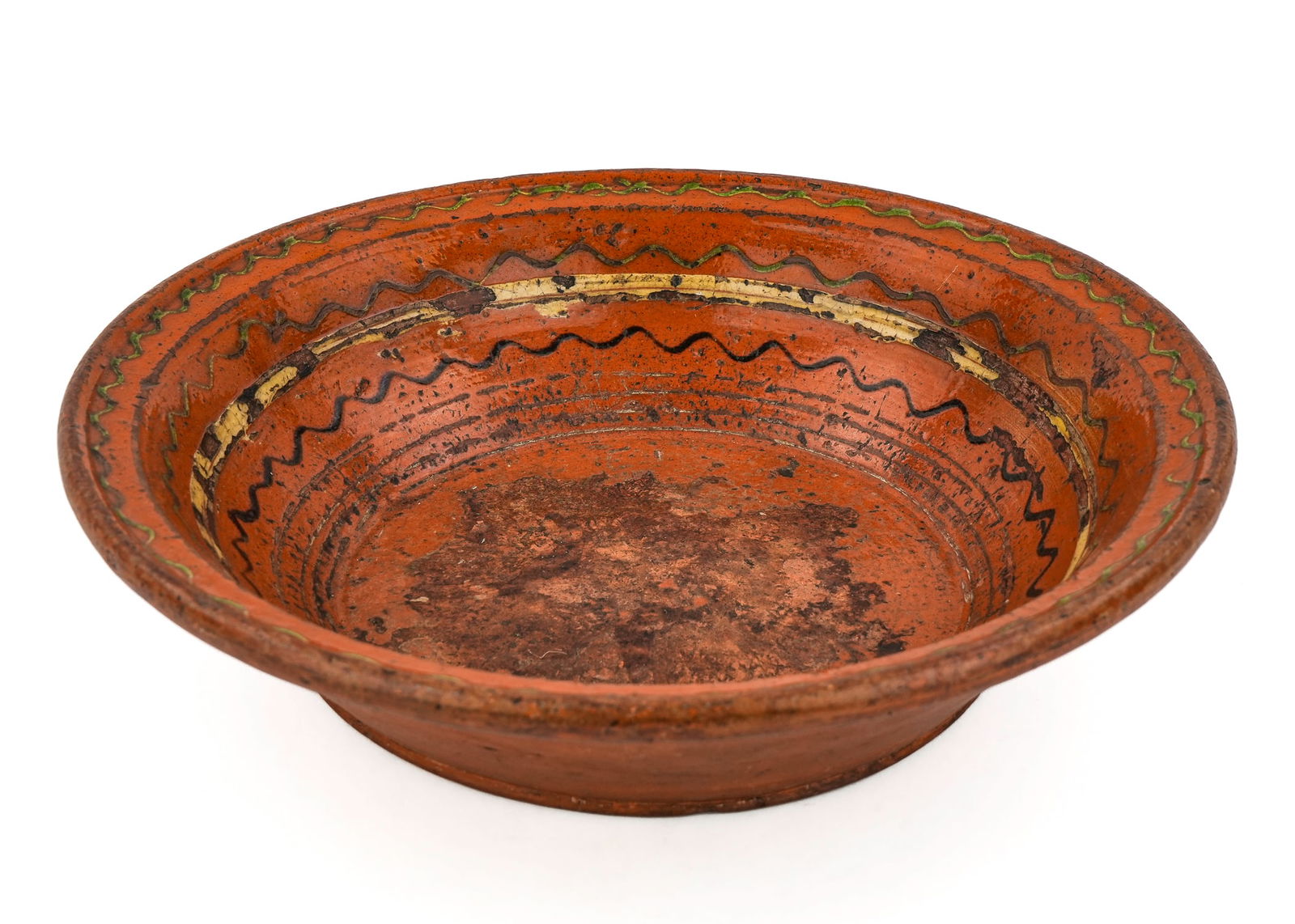 19th c. Shenandoah Valley Moravian Redware Bowl: Rare early 19th c. Shenandoah Valley Moravian redware pottery bowl having yellow, green and black slip decoration, possibly by Henry Adam Hagerstown, MD, small old chip to rim, heavy wear to interior