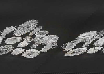 20 pcs. Clear Blown Molded Child's Glassware: 19th c American blown molded child's clear pattern glass. Vegetables, platters, cups, pitchers, and compotes. 3/4"h, to 2 1/4" h. Overall good condition.