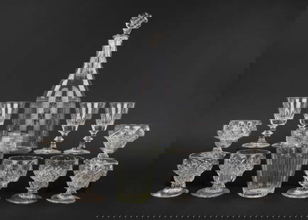 13 pcs. Early Blown Glass Tableware: Group of 13 pcs of early blown glass tableware including 7 blown quilted footed goblets, 4 blown paneled knob stem dessert goblets, mallet form decanter with engraved drape and tassel decoration, face