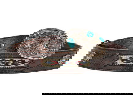Navajo Silver & Turquoise Belt Buckle and Belt: South West Vintage belt with oval silver Navajo belt buckle in floral motif and 3 Turquoise stones signed RT 3" x 2 1/4". With leather belt having 3 woven 3 color panels and 4 engraved silver rosettes