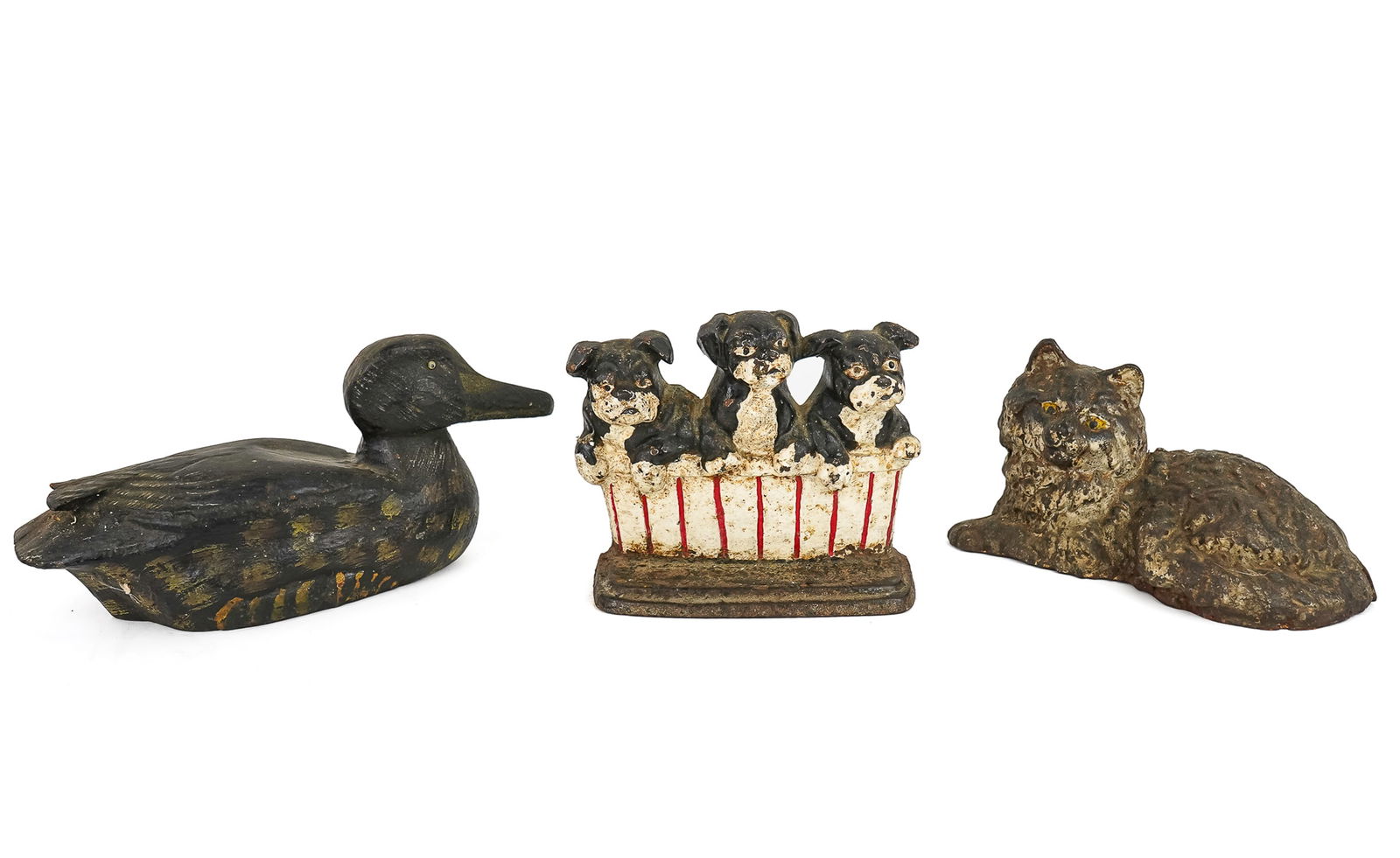 3 Cast Iron Figural Doorstops: Three Cast Iron Figural door stops- circa 1930 repainted basket of three puppies 6.5 x 8" Persian Cat 10 x 6" Decoy 12 x 6: with one cracked tail feather.
