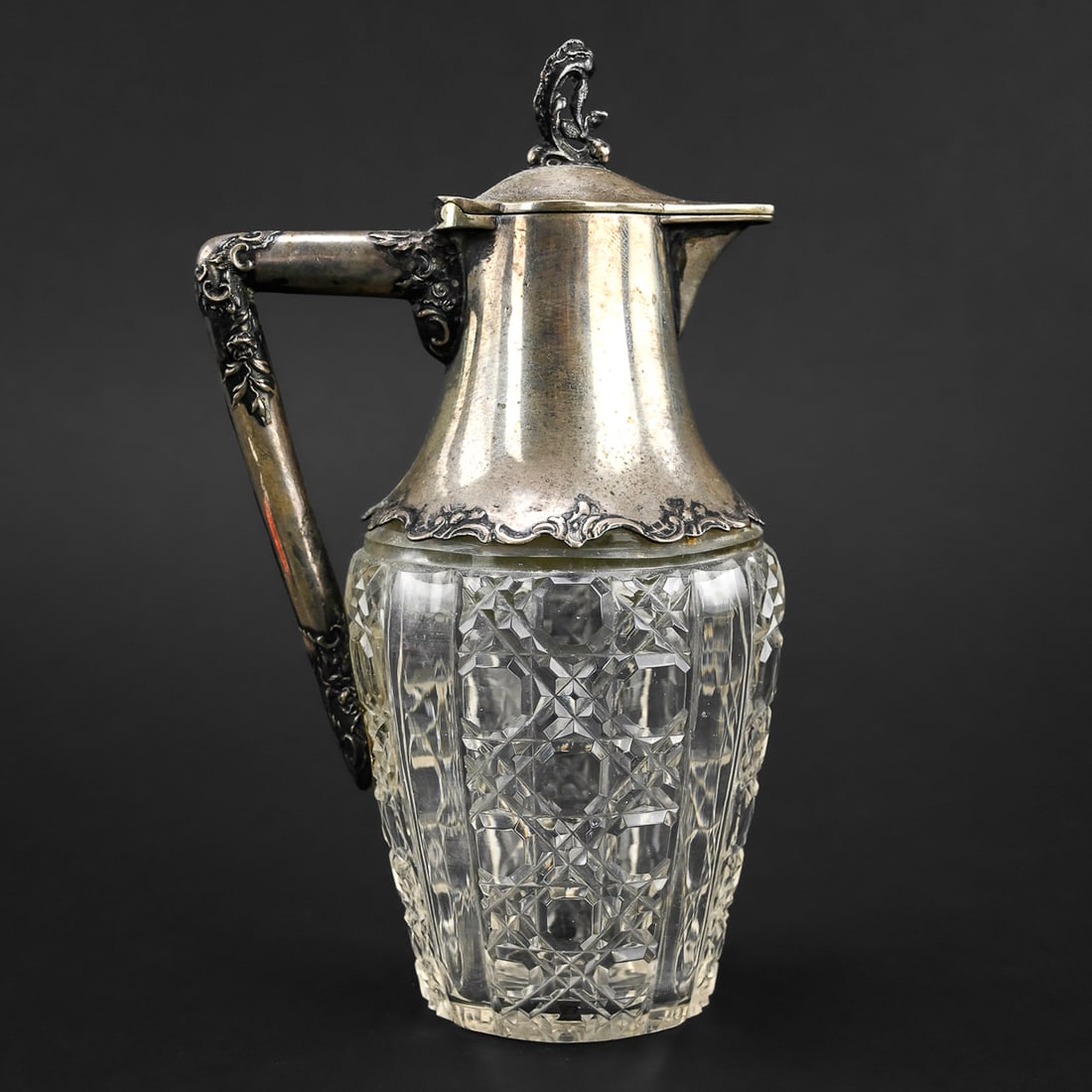 Early 20th C. Edwardian Syrup Pitcher: Edwardian-era syrup pitcher with a crosshatch pattern, stamped "AP" on the metal lid. Likely early 20th century. Measures approximately 6" tall by 2.5" wide.