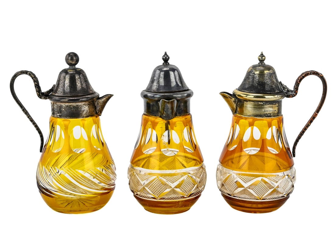 3 Amber Cut-to-Clear Syrup Pitchers, Made in England: Set of three small amber cut-to-clear glass syrup pitchers, each stamped "MADE IN ENGLAND." Likely produced by Thomas Webb & Sons or Davidson Glass. Each measures approximately 5" tall by 2.5" wide.