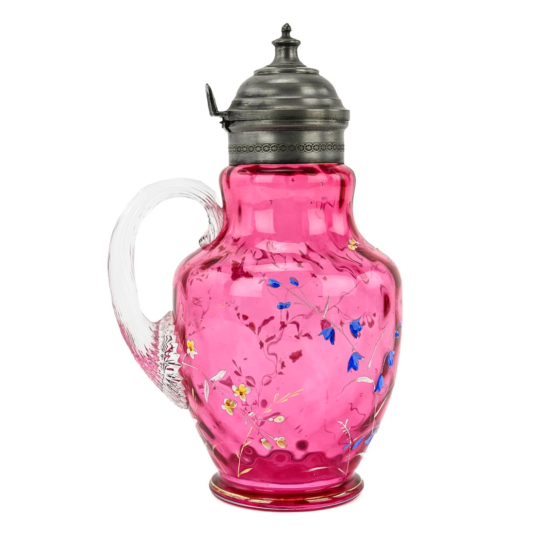 Cranberry Glass Syrup Pitcher with Plumeria Decoration: Cranberry glass syrup pitcher with hand-painted plumeria flower designs, clear ribbed applied handle, and a pewter lid. Measures approximately 7.5" tall by 4" wide.
