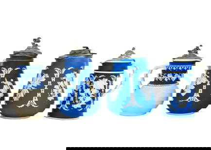 4 Pcs Jasper Wedgwood: Group of four classic Jasperware Wedgwood pieces, each featuring traditional grape, leaf, and mythological motifs in raised white relief. All pieces are topped with pewter lids. The largest measures a