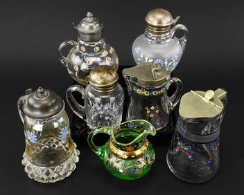 Group of 7 Enamel Decorated Syrup Pitchers