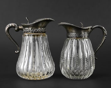 Pair of Sterling Lidded Cut Glass Syrup Pitchers