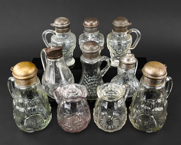 10 Pressed Glass Syrup Pitchers with Floral Motifs