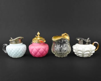 Group of 4 Decorative Syrup Pitchers