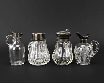 Four Small Syrup & Claret Jugs with Sterling Mounts