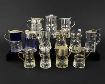 Thirteen Cut and Pressed Glass Syrup Pitchers