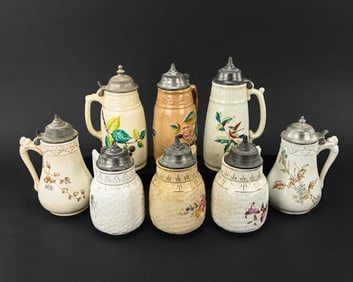 Eight Bennet’s Patent Transferware Stoneware Jugs with Pewter Lids