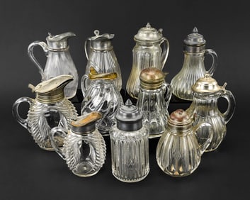 11 EAPG Pressed Glass Syrup Pitchers