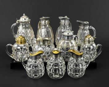 11 Pressed Pattern Glass Syrup Pitchers