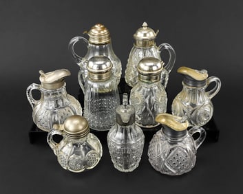 9 Pressed Glass Syrup Pitchers