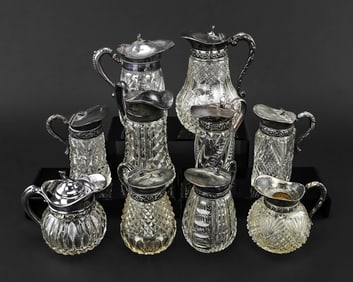 10 Cut Glass Syrup Pitchers, Some Silver Plate