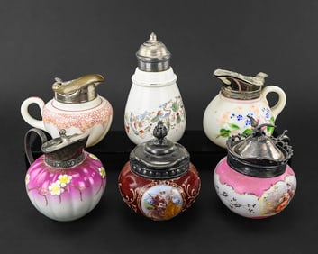 6 Decorated Milk Glass Syrup Pitchers