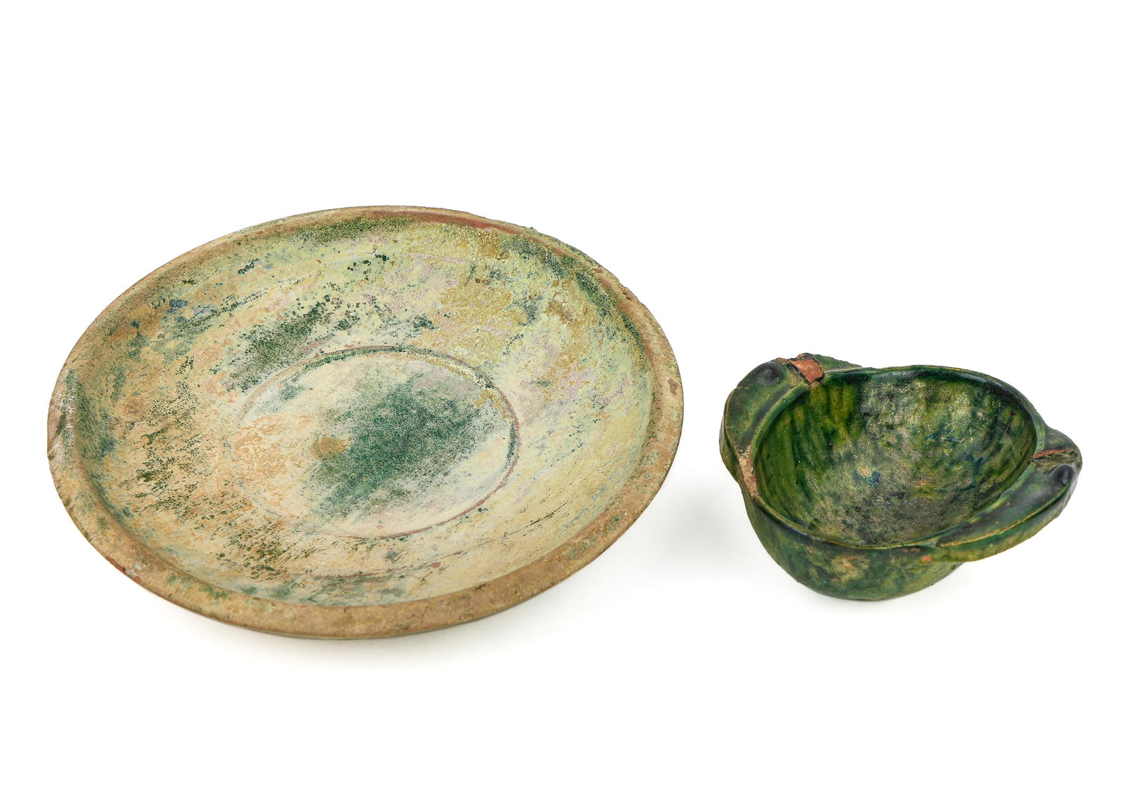 Antique Chinese Han Dynasty Plate and Cup: Chinese Han Dynasty plate and cup (202 BC- 220 AD), plate with flecks of green glaze with some iridescence, diameter 6 3/4" sold with a Chinese Han Dynasty cup, diameter 4" x 3"