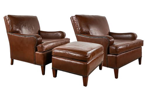 Pair of Leather Armchairs, and ottoman: Pair of Leather upholstered armchairs and an ottoman, rebuilt by AAA Art Upholstery. in excellent overall condition.