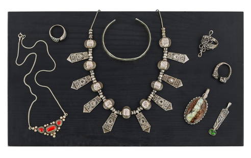 Silver Jewelry: A group of sterling jewelry including hammered finish bangle, hardstone oval pendant, lion facing ring, small Navajo