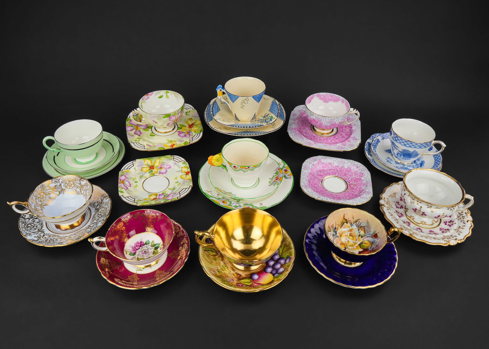 Collection of Bone China Tea Cups incl. Aynsley: Collection of 15 fine English bone china porcelain tea cups and saucers including Aynsley Nancy Brunt signed fruit decorated set with fully gilt interior bowl, Aynsley J.A. Bailey signed set with flor
