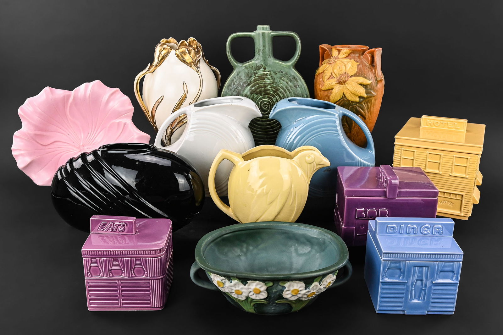 13 pcs. Mid and Late 20th C. Art Pottery: 13 pcs. mid and late 20th c. art pottery including Roseville vase and bowl, 2 Homer Laughlin Fiestaware , 4 pc. "American Roadside by John Baeder for Sigma The Tastesetter" canister set, Art Nouveau v