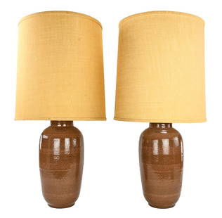 Pair of Mid Century Pottery Table Lamps: Pair of mid century stoneware pottery cylindrical form table lamps having period appropriate burlap covered barrel form shades, overall good condition 32" x 9.5"