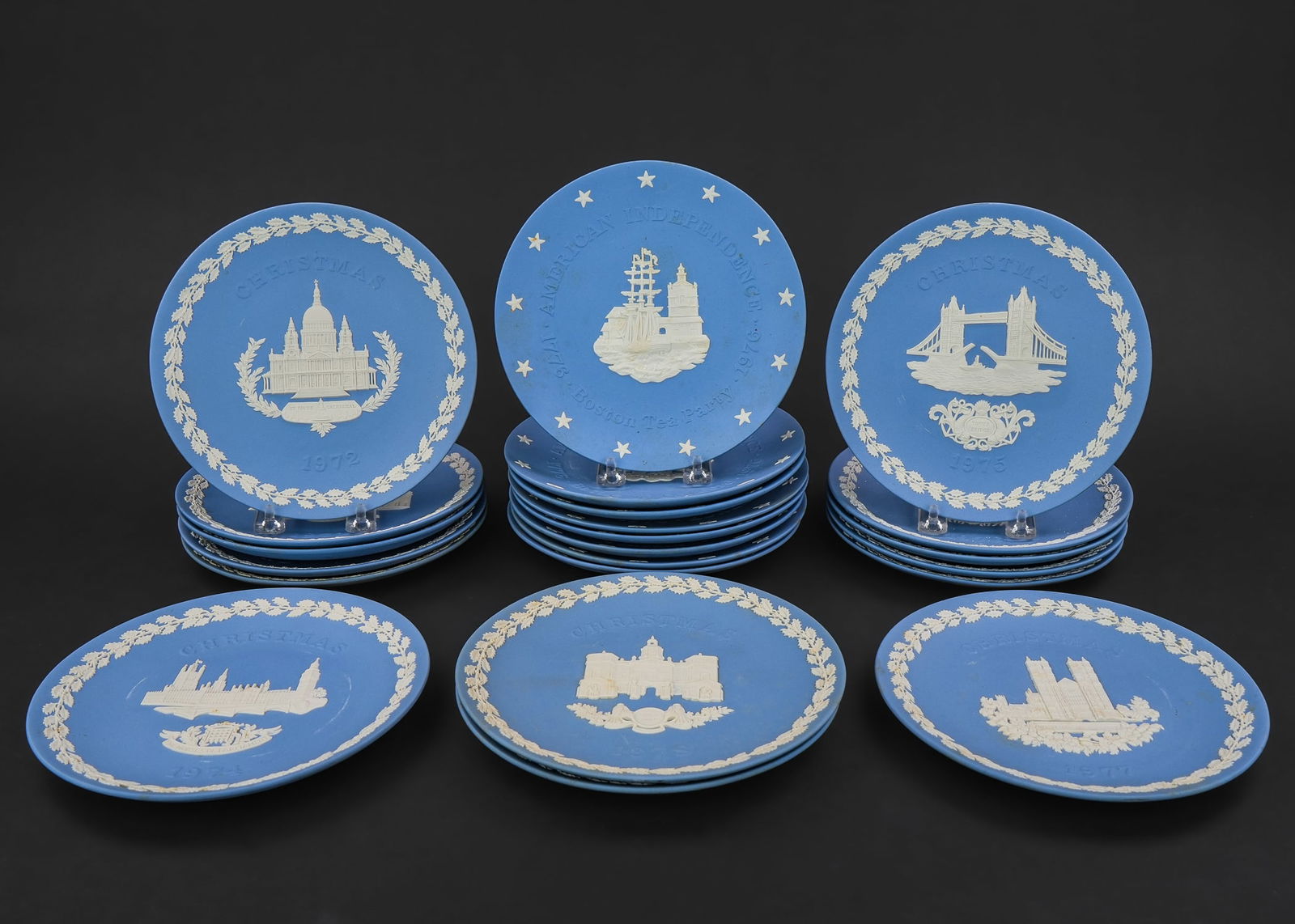 22 Wedgwood Jasperware Christmas Plates: Collection of 22 Wedgwood light blue Jasperware pottery commemorative Christmas plates, each depicting a different British landmark, accompanied by a number of American patriotic plates dia. 8.25"