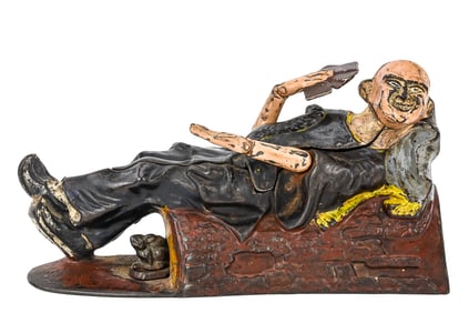 Reclining Chinaman Mechanical Bank