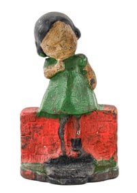 Girl on Brick Wall Cast Iron Doorstop
