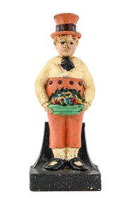 Cast Iron Boy with Flowers Doorstop
