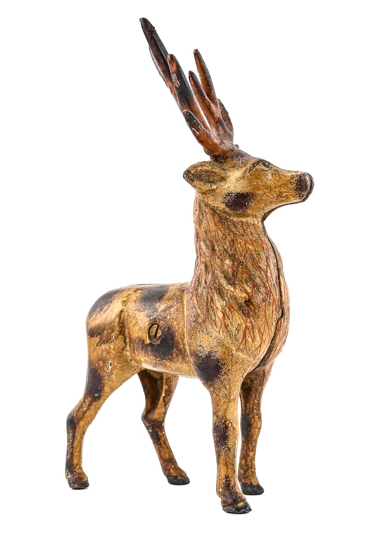 Cast Iron “Putz?? Reindeer Doorstop: Cast iron doorstop depicting a reindeer, often referred to as a “Putz Deer.” Retains painted surface with age-appropriate wear. Measures approx. 6" L x 9" T.