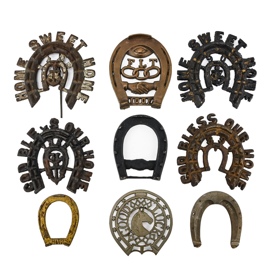 Horse-Themed Cast Iron Trivets (9 Pieces): Group of nine horse-themed trivets, including horseshoes with monogrammed initials and inscriptions such as “Good Luck.” Largest measures approx. 5" x 6". Retain original patina and light age-
