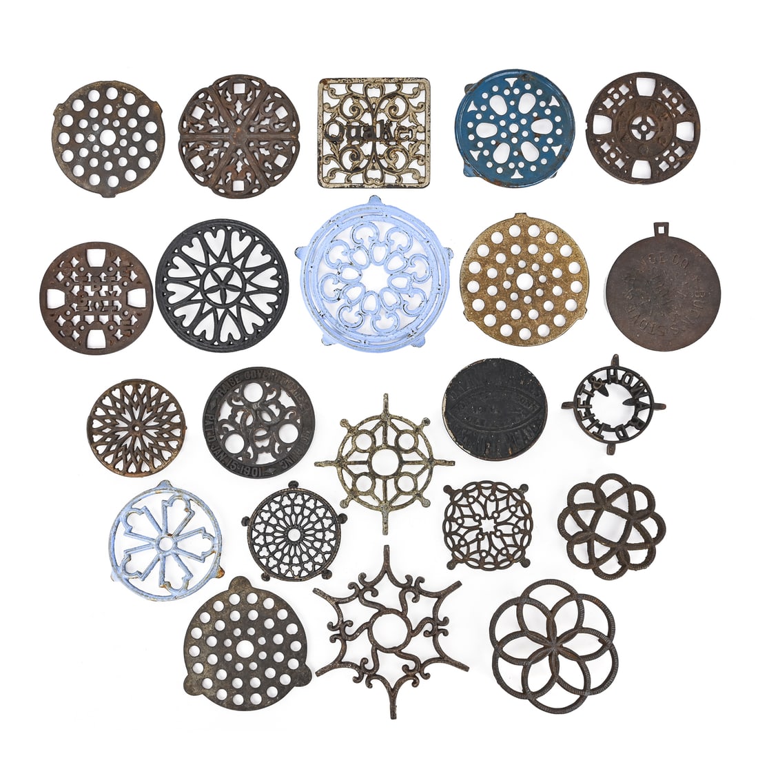 Group of 22 Cast Iron and Enamel-Painted Trivets (1 of 7)