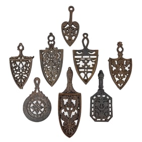 Group of 8 Cast Iron Spade Trivets