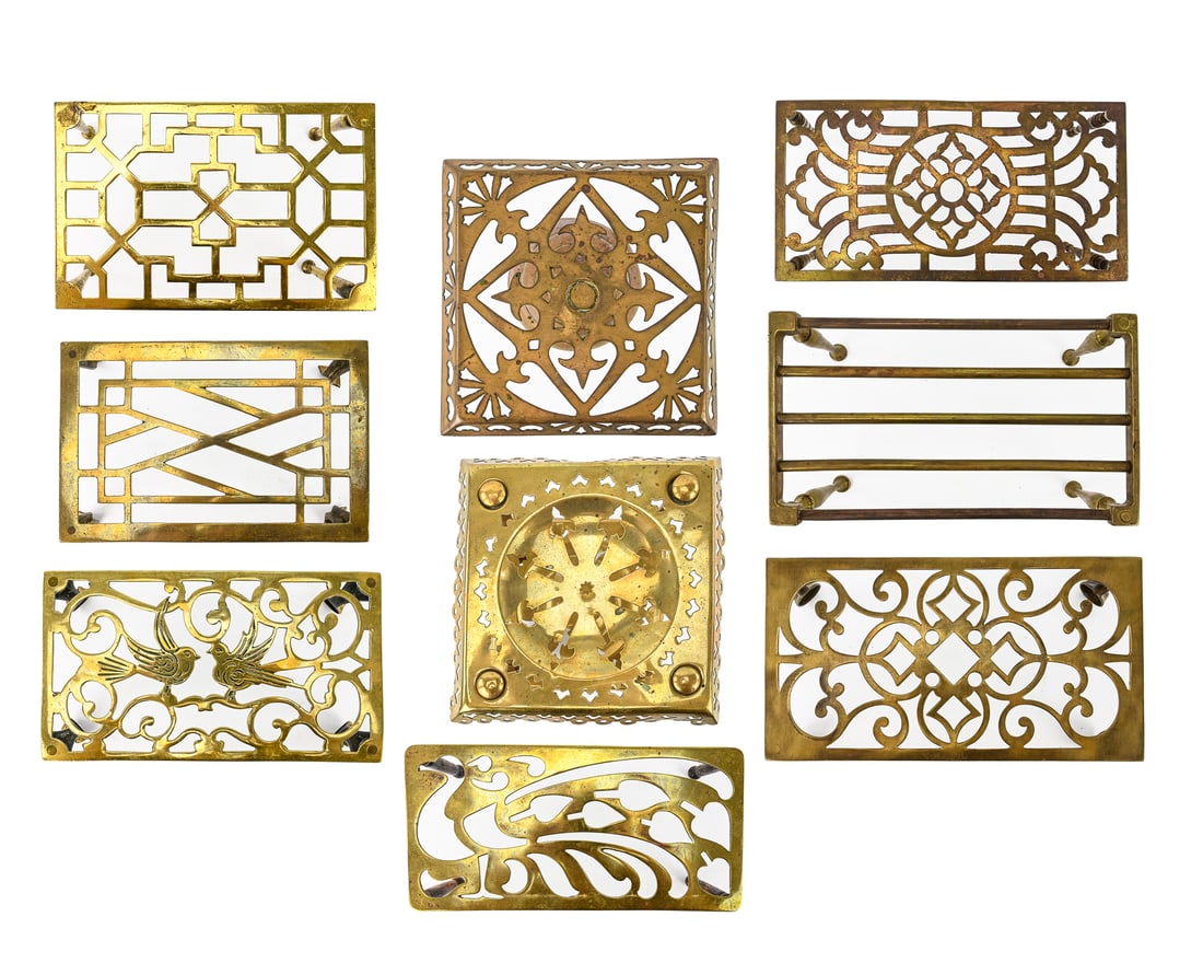 Group of 9 Trivets, Pan Stands, or Cake Stands: Assortment of 9 trivets, pan stands, or cake stands, likely dating to the 19th or early 20th century. Two pieces measure approximately 9" H, including one marked Rd 159780.