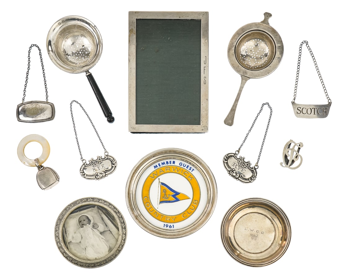 Lot of Assorted Sterling and Silver Items: Lot of assorted sterling silver decorative accessories including round and square portrait frames, two tea strainers, rattle, small round dish, Warwick Country Club sterling banded bottle coaster, 4 l