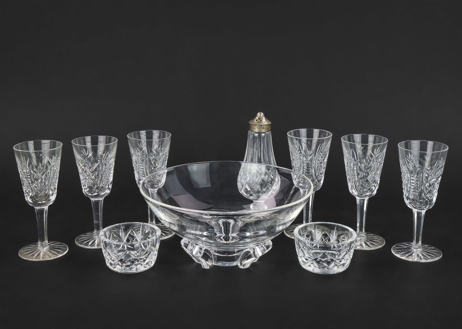 Waterford, Steuben Crystal Tableware: Group of 11 pcs. of fine crystal tableware including a Steuben petal footed centerpiece bowl, 6 Waterford "Clare" dessert wine goblets, Waterford "Lismore" footed pepper pot, Waterford champagne flute