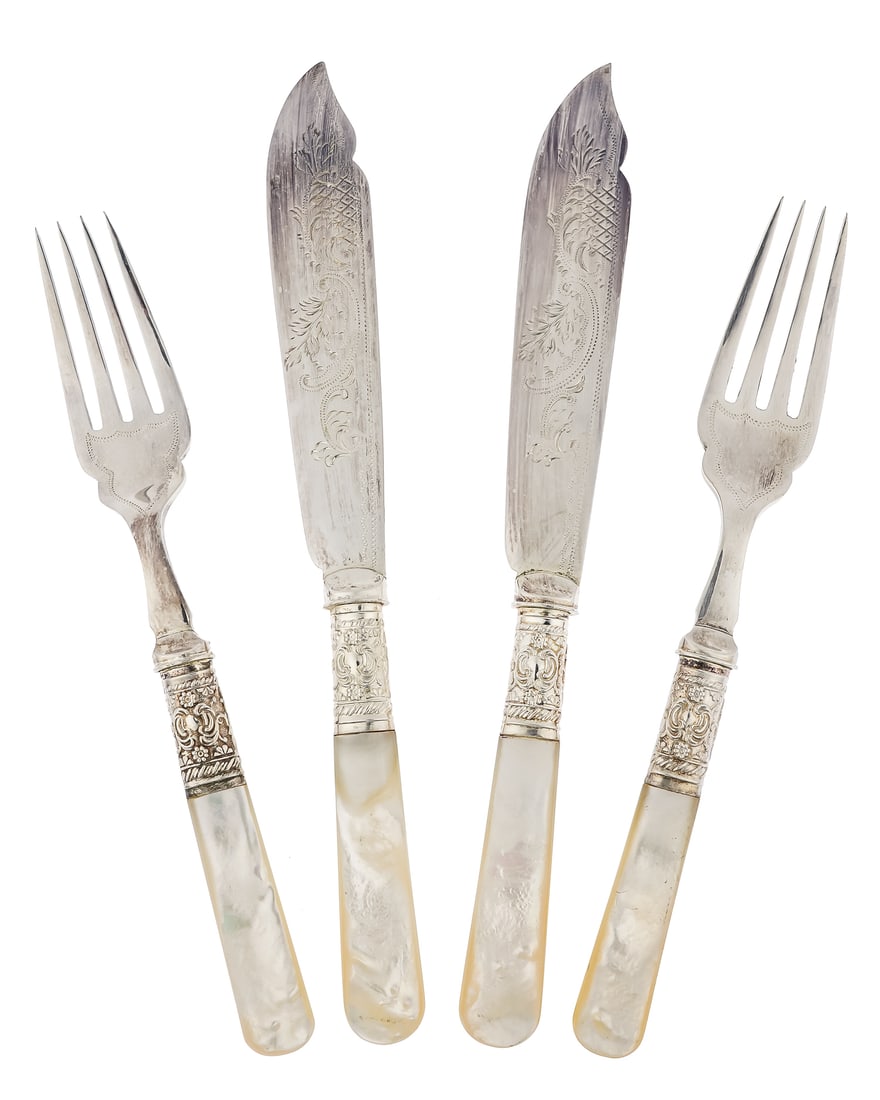 Cased Set of Mother of Pearl Handled Cutlery: Fine Edwardian era set of cutlery having sterling cuffs, ornately engraved blades, and mother of pearl abalone handles, consisting of 12 forks and 12 knives in a fitted mahogany presentation case, som