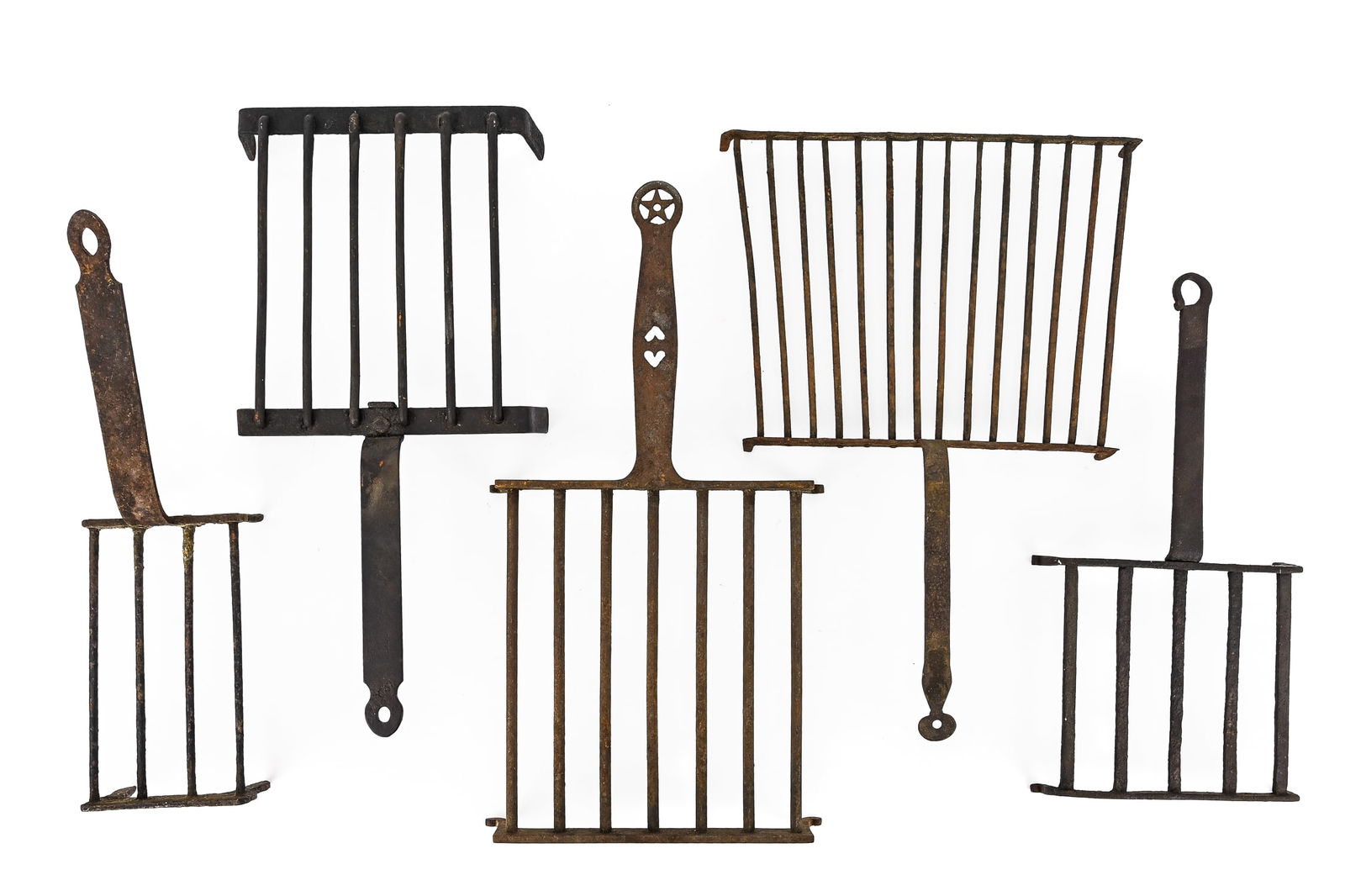 Group of Handled Wire Toasters / Gridirons / Trivets: Assortment of handled wire toasters or gridirons, likely used historically for cooking or supporting pots and pans over a fire. Long handles and wire platforms. Largest measures 16" L x 9" W.