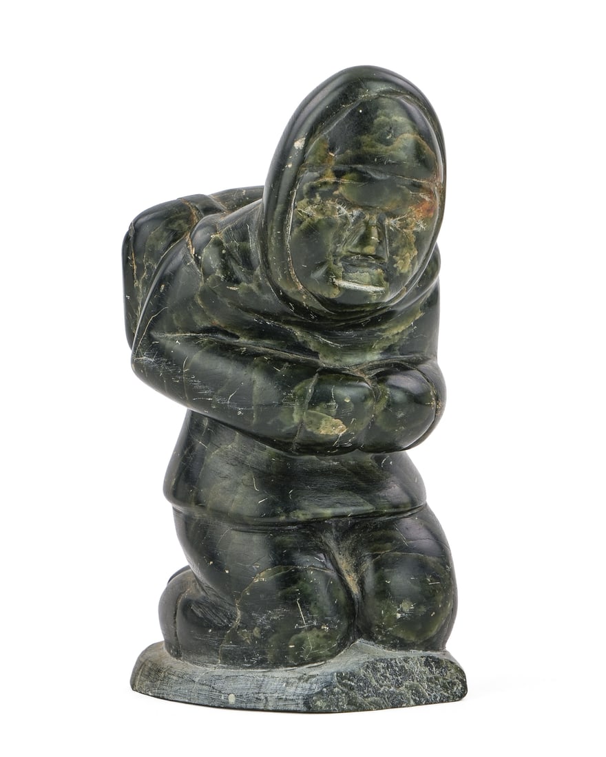 Inuit Sculpture of a Hunter with a Backpack: Inuit dark soapstone sculpture of a hunter with a backpack signed AC 05 on base, ht 6 1/4"