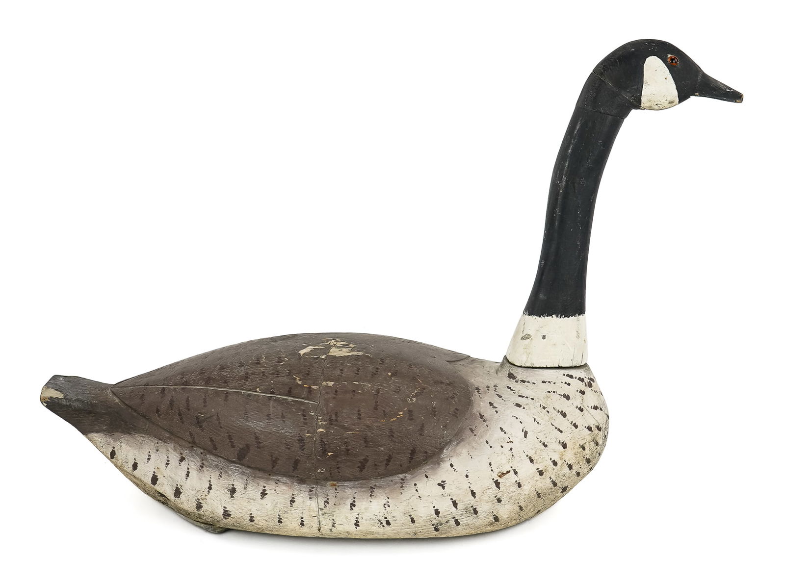 Canadian Goose Decoy: Fine early 20th c Canadian goose decoy. Separate carved neck and head. Glass eye (missing one). Carved wing back. Working bird, square side weight, leather loop. Original paint, old chip to tail. 27"