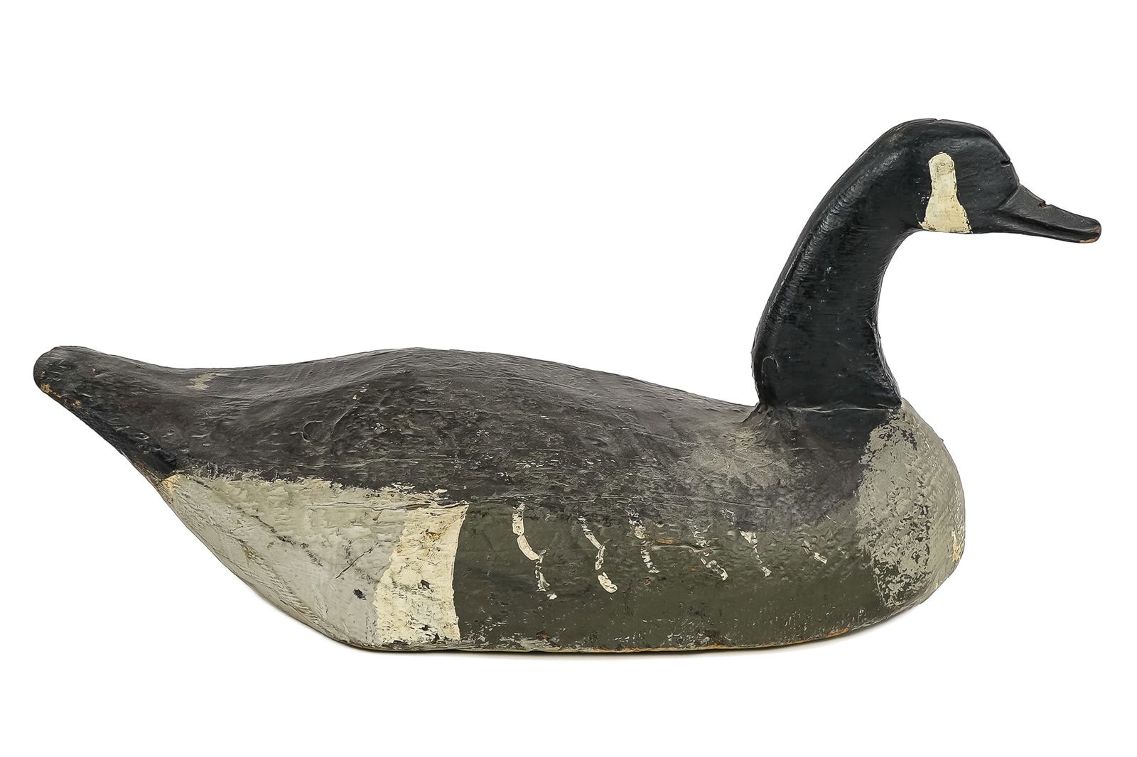 19th. C Canadian Goose Decoy: Primitive early 20th or late 19thc Canadian goose decoy. Solid body, carved neck and head. Old working repainted surface. 25" x 12".