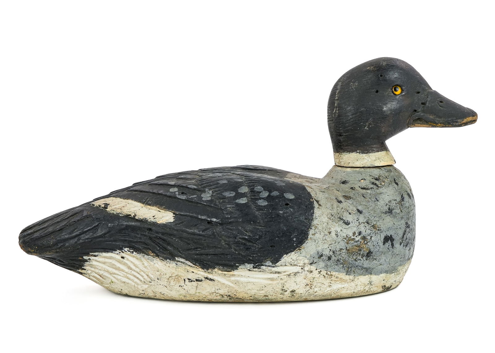 Paquette Quebec Goldeneye Decoy: Joseph Paquette Verdun, Quebec whistler hen decoy. Original paint, carved feather body and detailed head, glass eye. Working wear with some shot. 14" long.